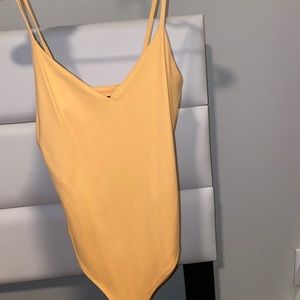 Yellow bodysuit